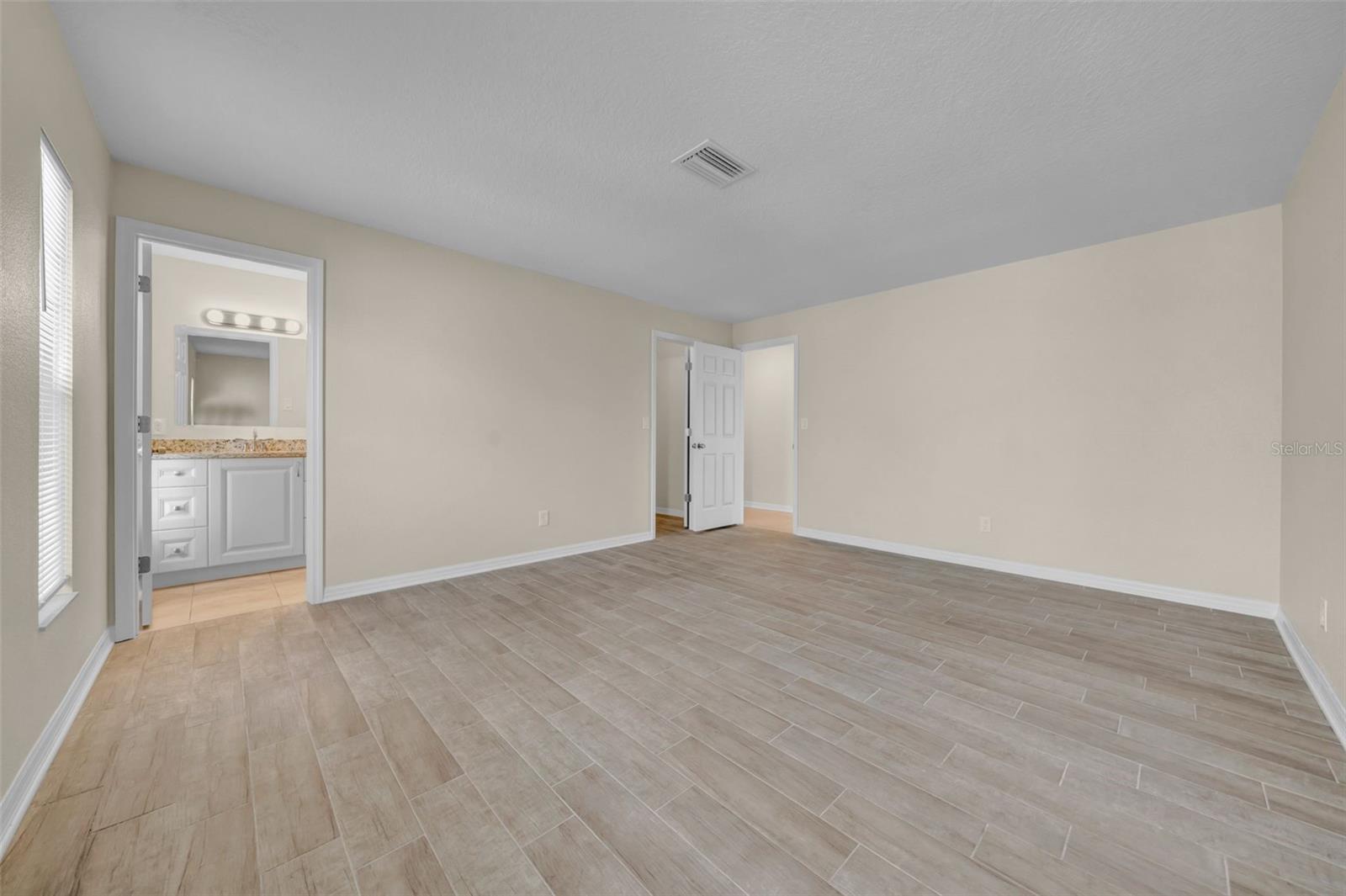 Primary bedroom and bathroom