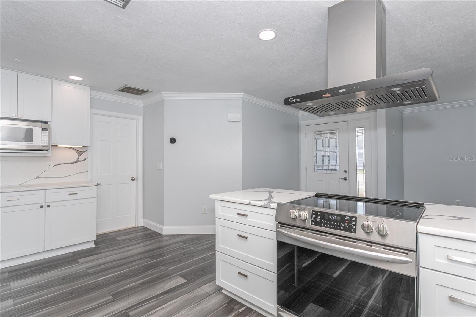 Kitchen facing front door and garage door