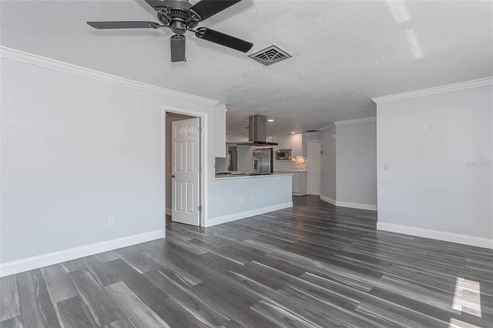 Beautiful crown moulding. Door to bonus room.