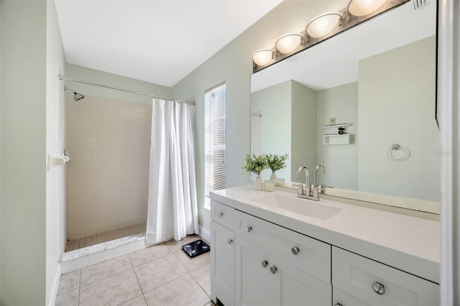 Ensuite bathroom with large tiled shower