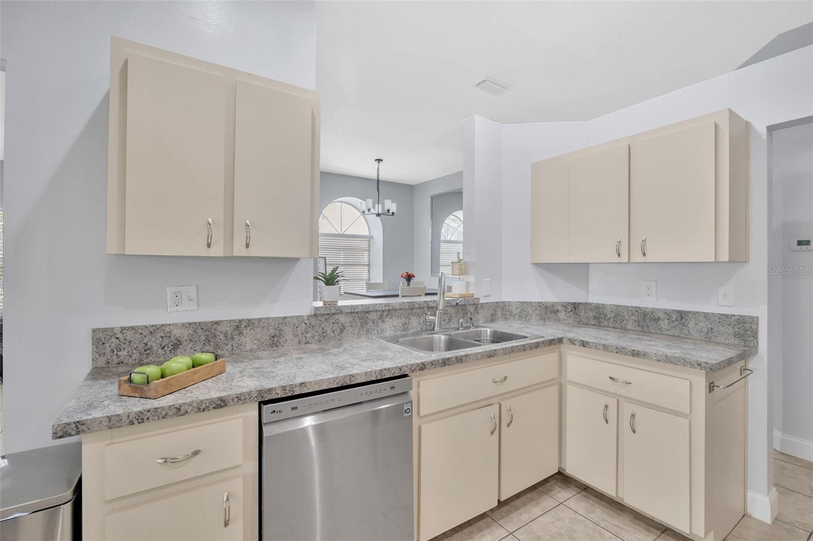 Bright and functional kitchen with clean, open design. Featuring newer stainless steel appliances.