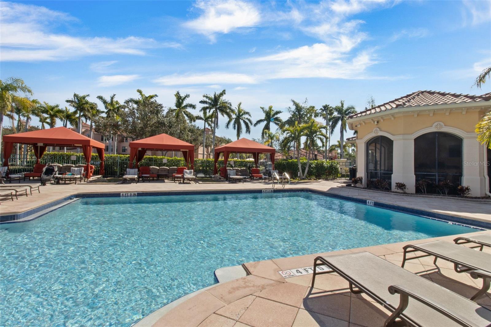 resort-style pool with cabanas