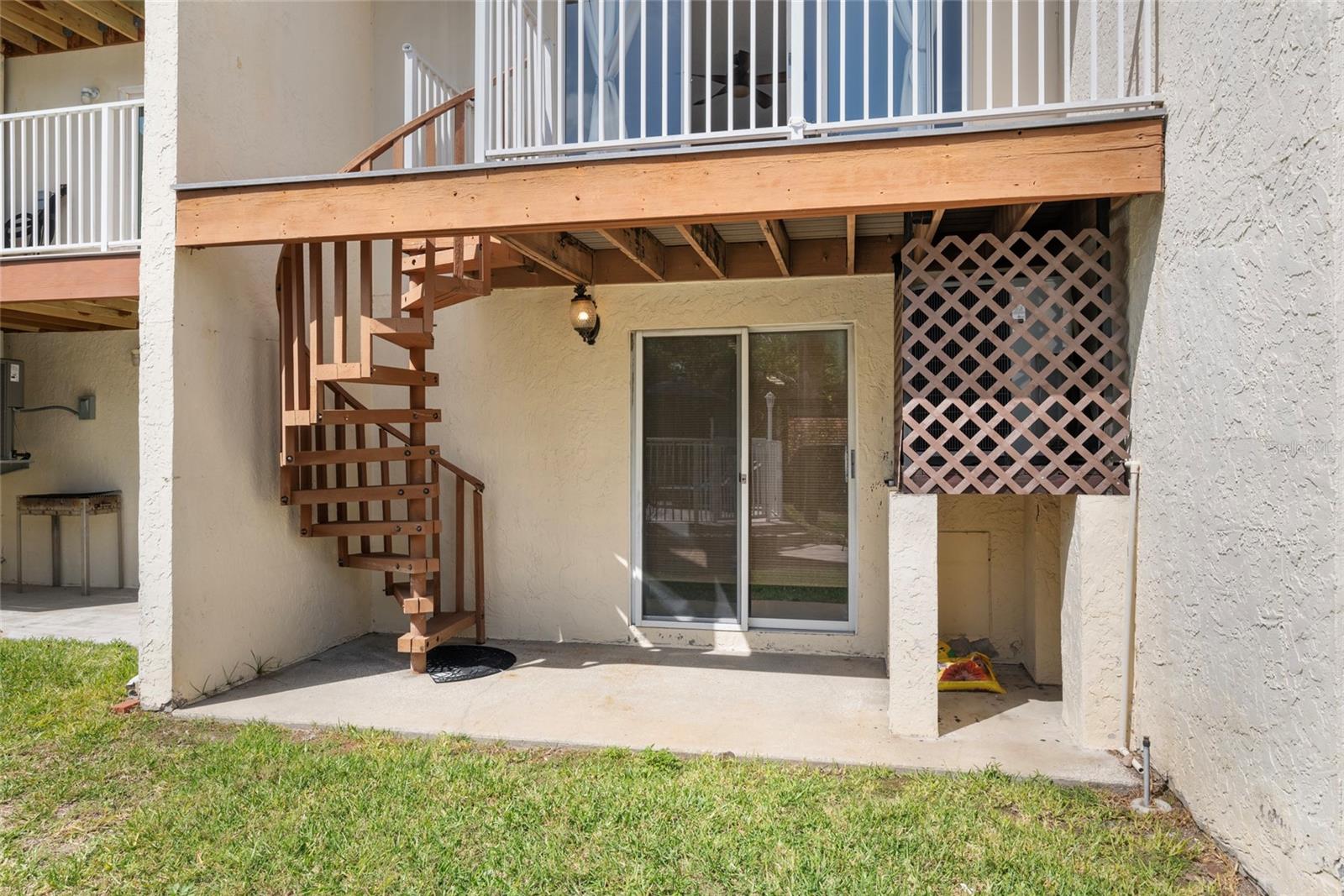 Back view, Sliders open to Garage/Community Pool