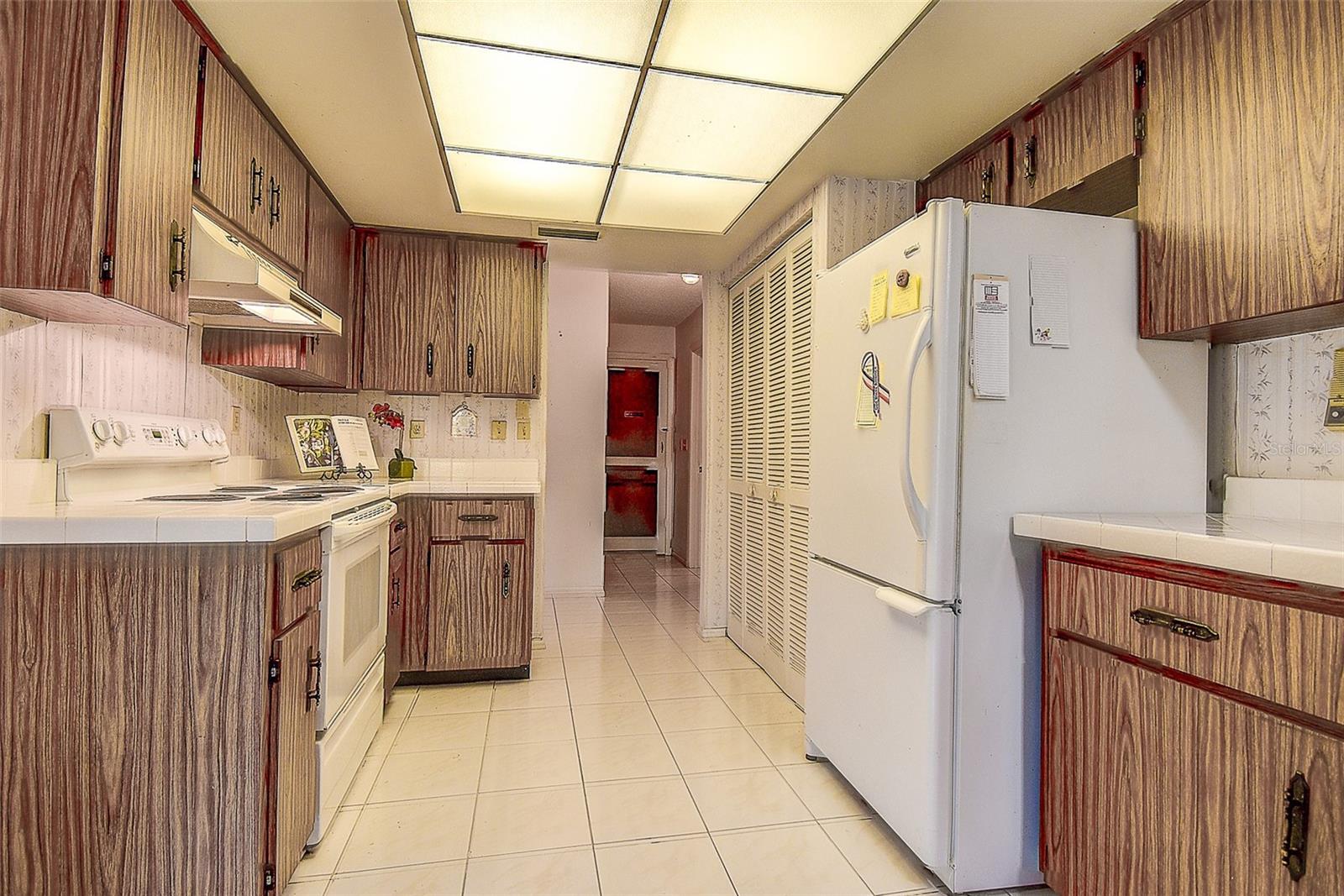 Kitchen and pantry to Garage in background