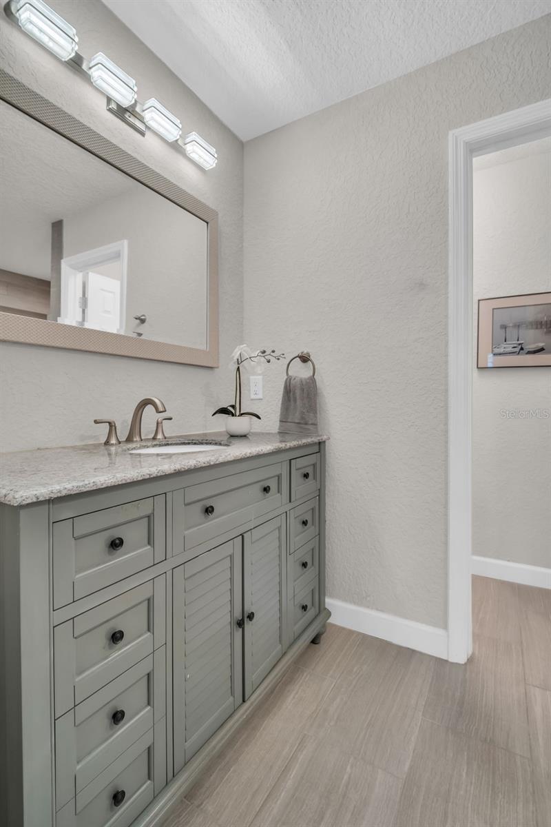 Stone countertops, great vanity storage, and a perfectly designed water closet for privacy~