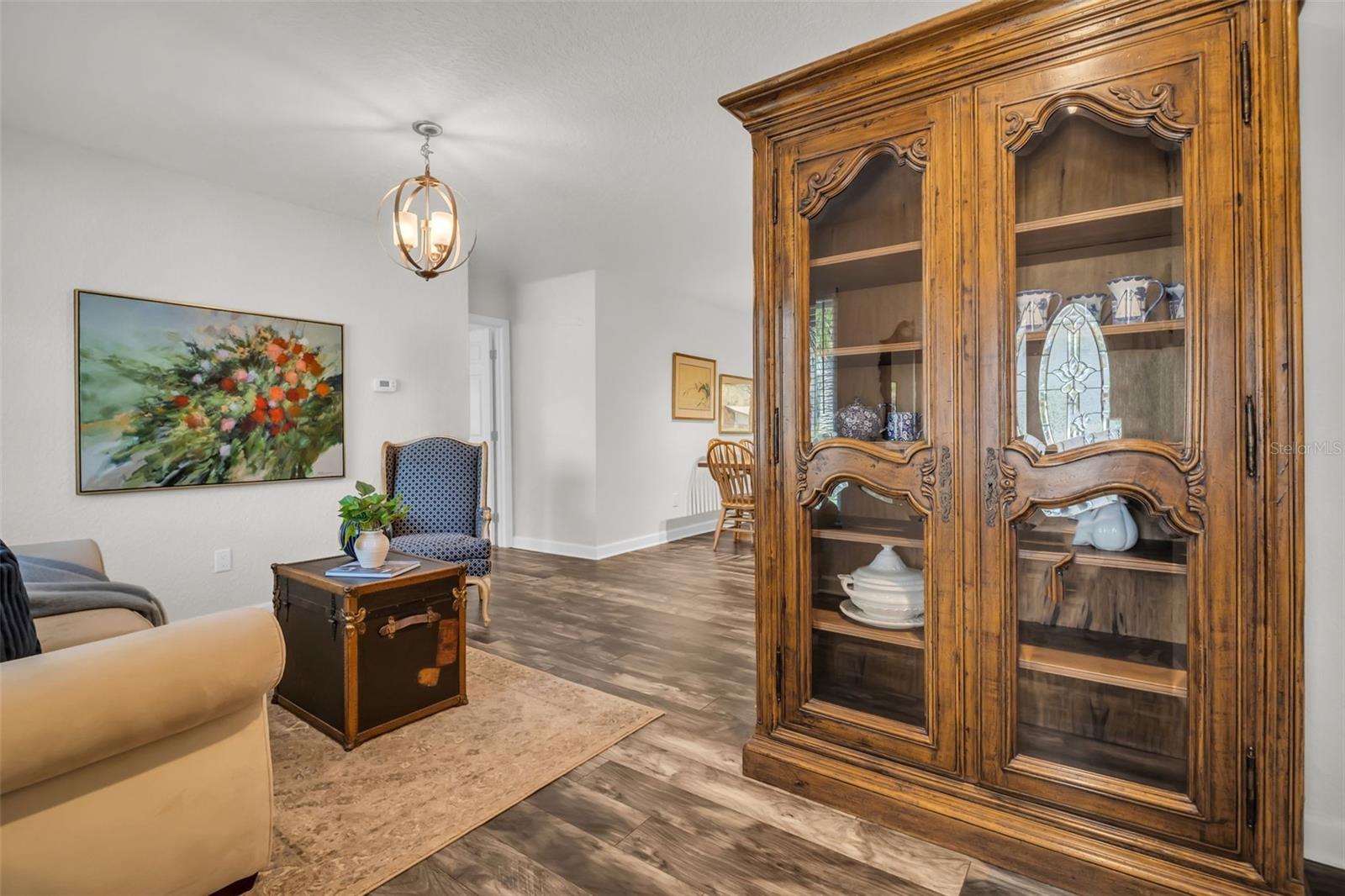 Welcoming front entry with newer luxury vinyl flooring, updated fixtures, & no popcorn ceilings~