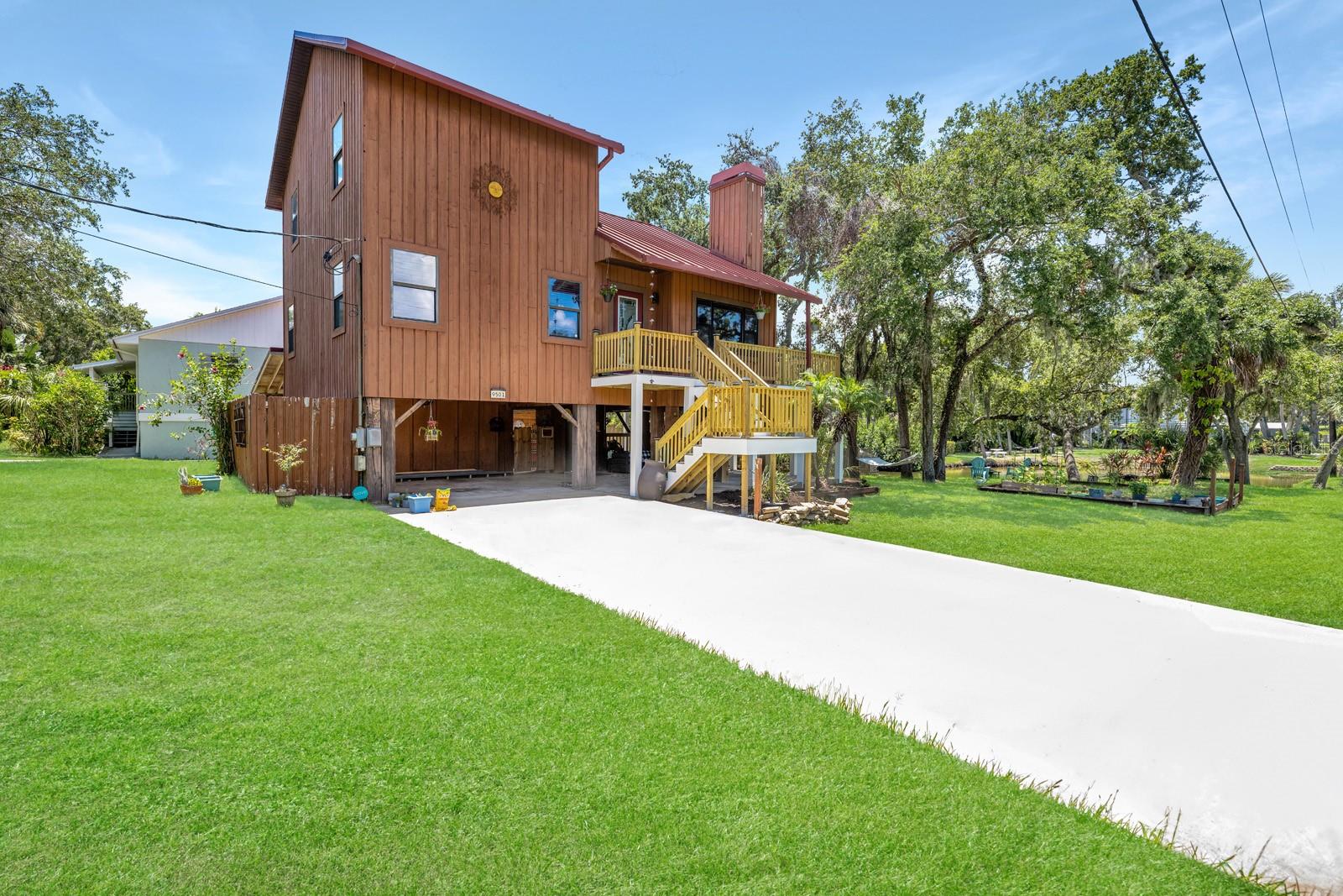 Front view of 9501 Alice Lane with new decking and stairs