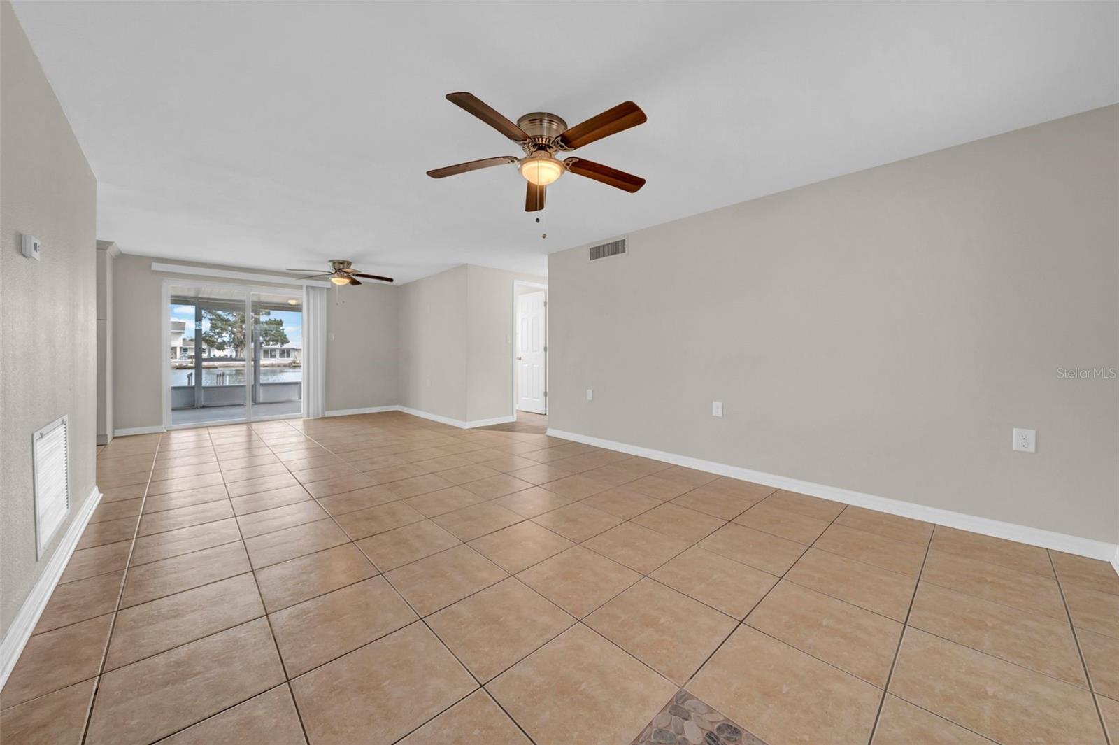 Spacious and open living room that leads right out to the lanai and the waterfront!!