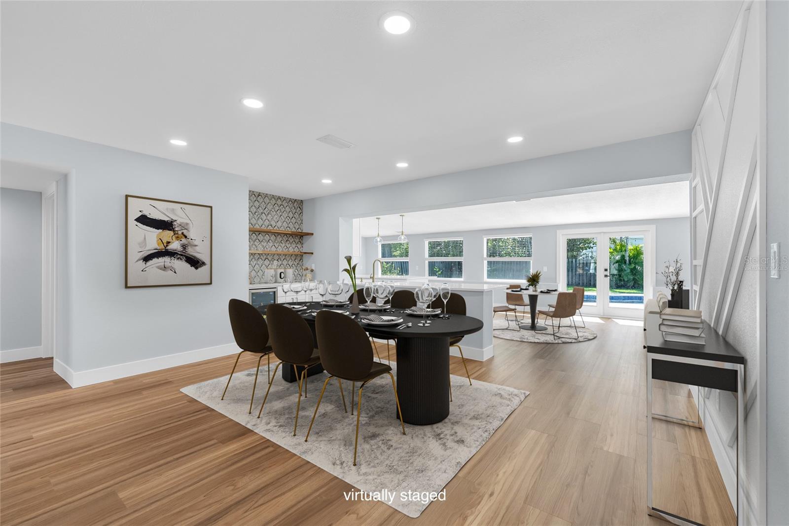 "Virtually Staged" Dining Area with Dry Bar open floor plan and view to Kitchen