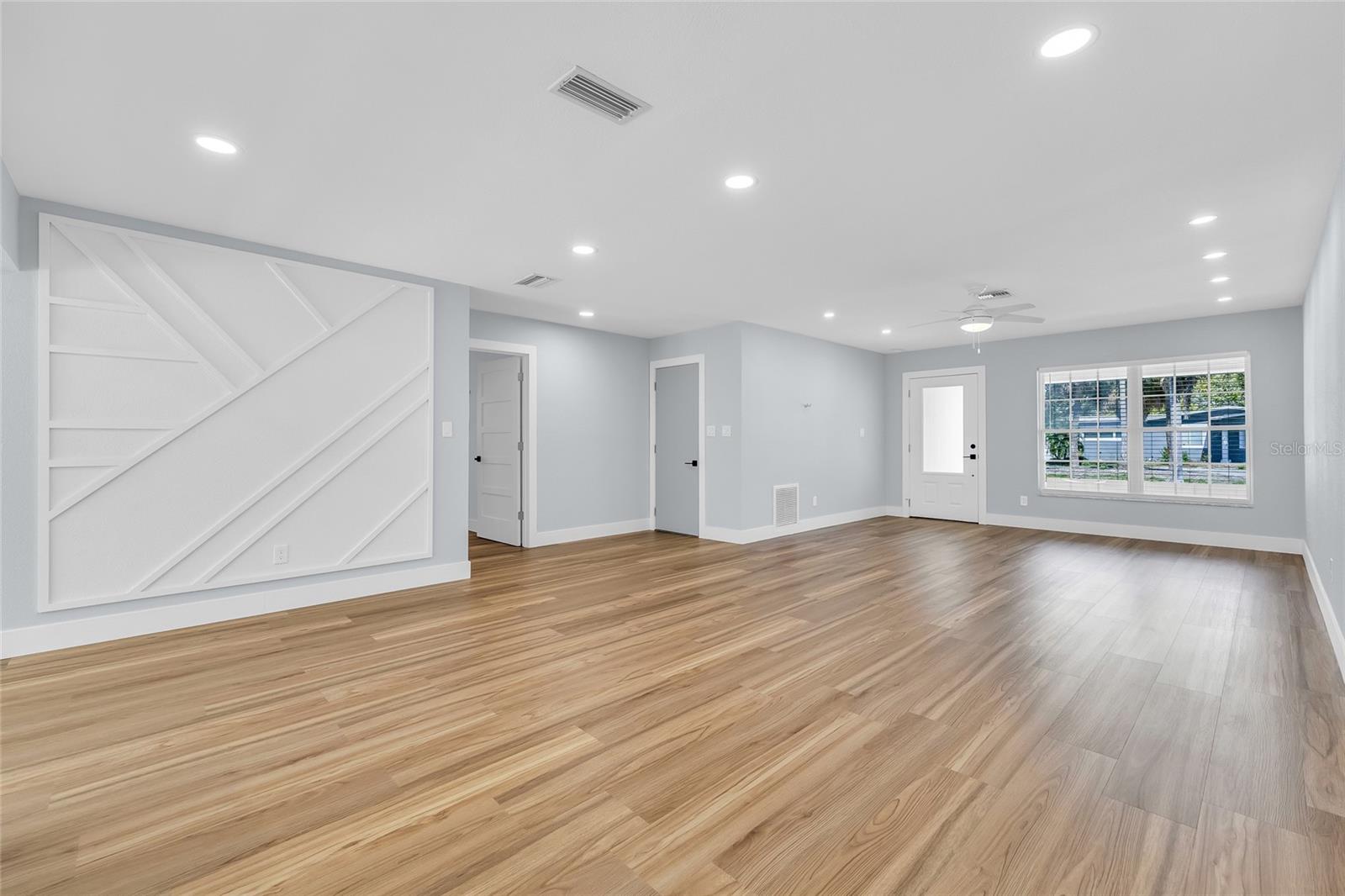 View of Living Room with Dining Area Feature Wall