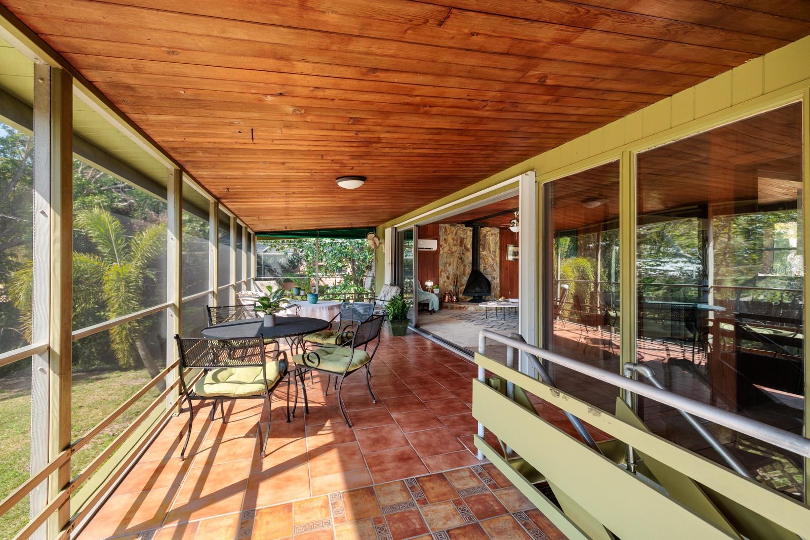 2nd floor "Birdcage" Patio with tile floor and tongue and groove cedar ceiling