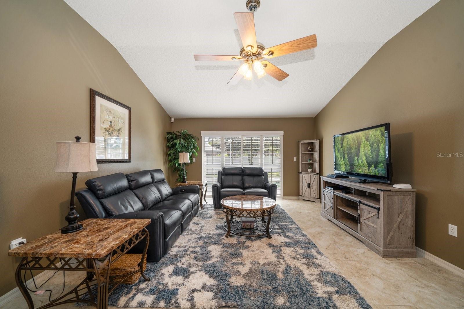 living room with access to pool area