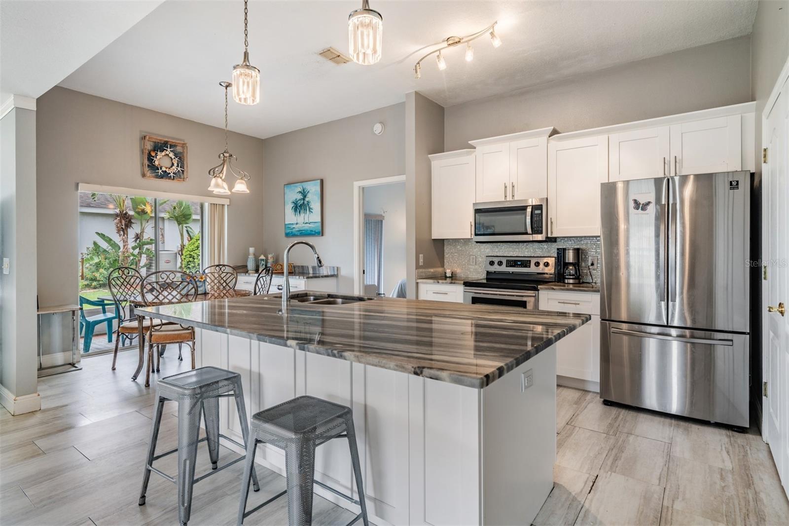 Renovated kitchen with Center island granite bar
