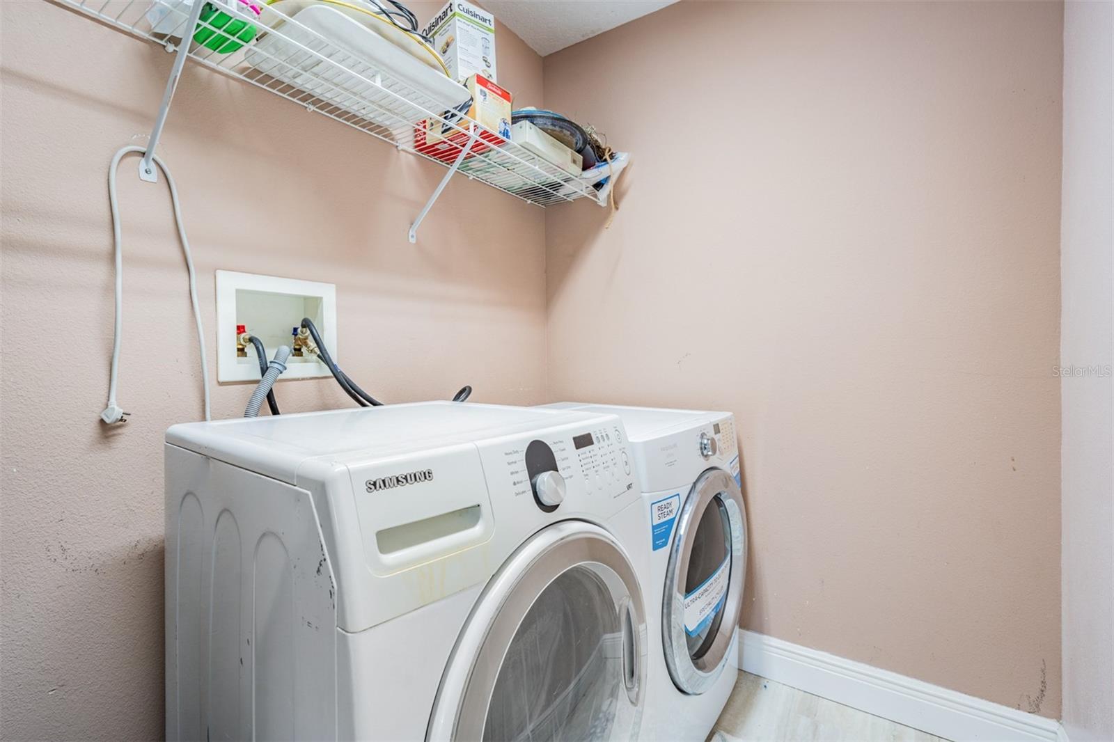 Separate interior Utility room with washer/dryer and storage area