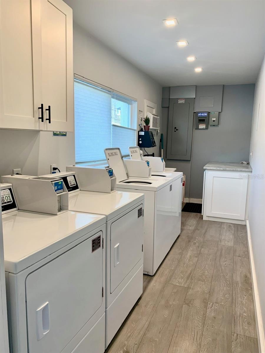 Renovated Community Laundry Room on first floor with AC