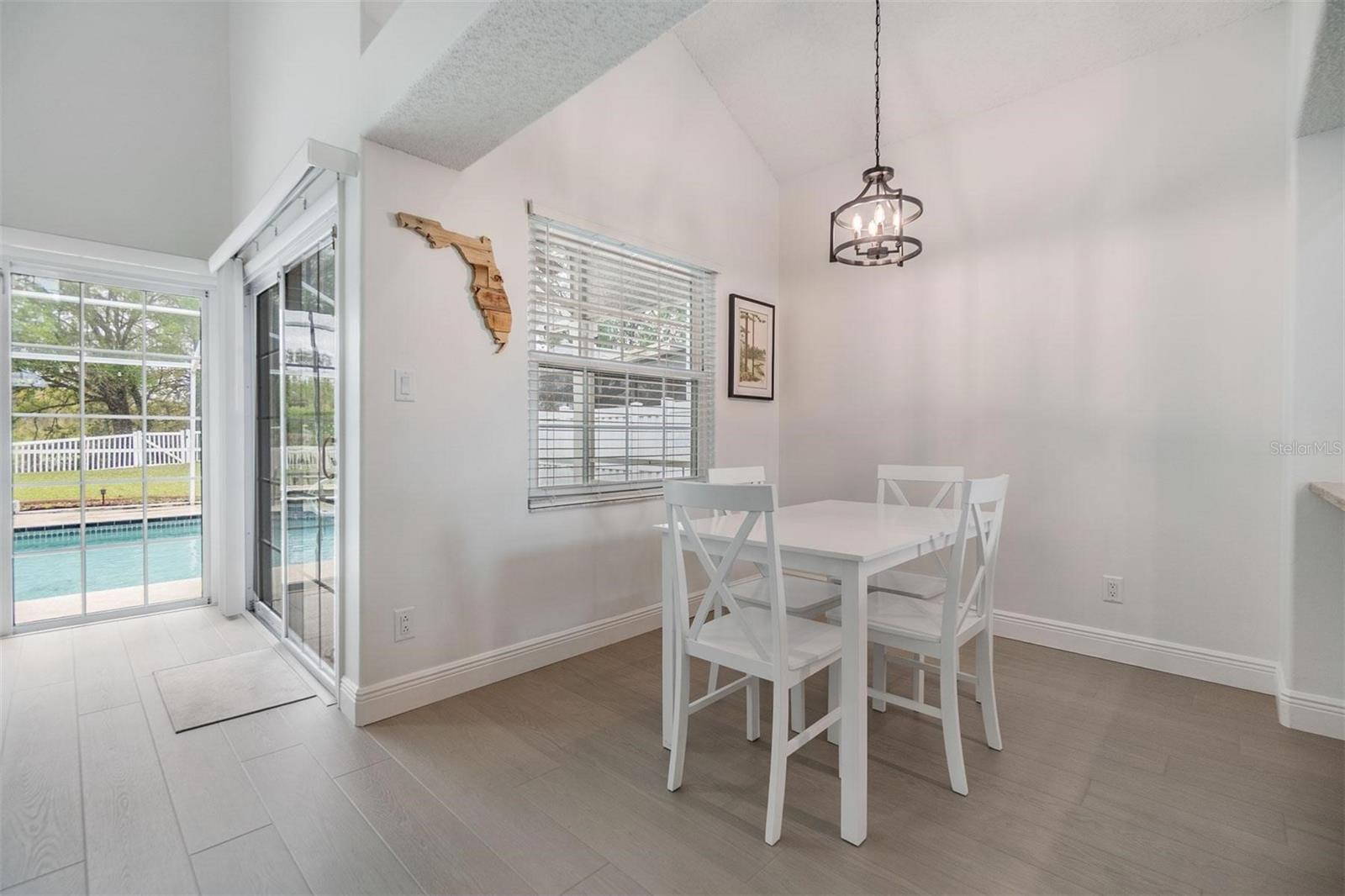 Dining room and sliders to the lanai and pool