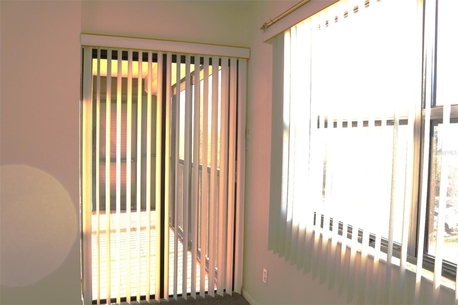 Primary bedroom with balcony access