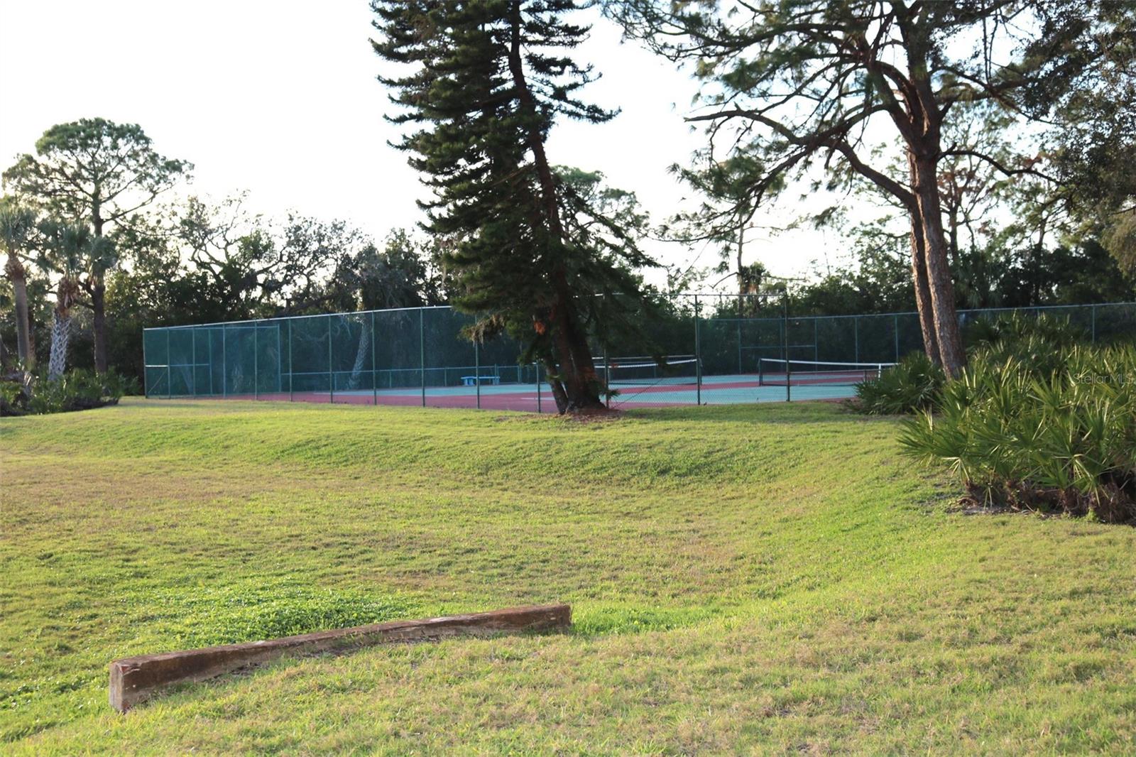 Grounds behind the building with tennis courts