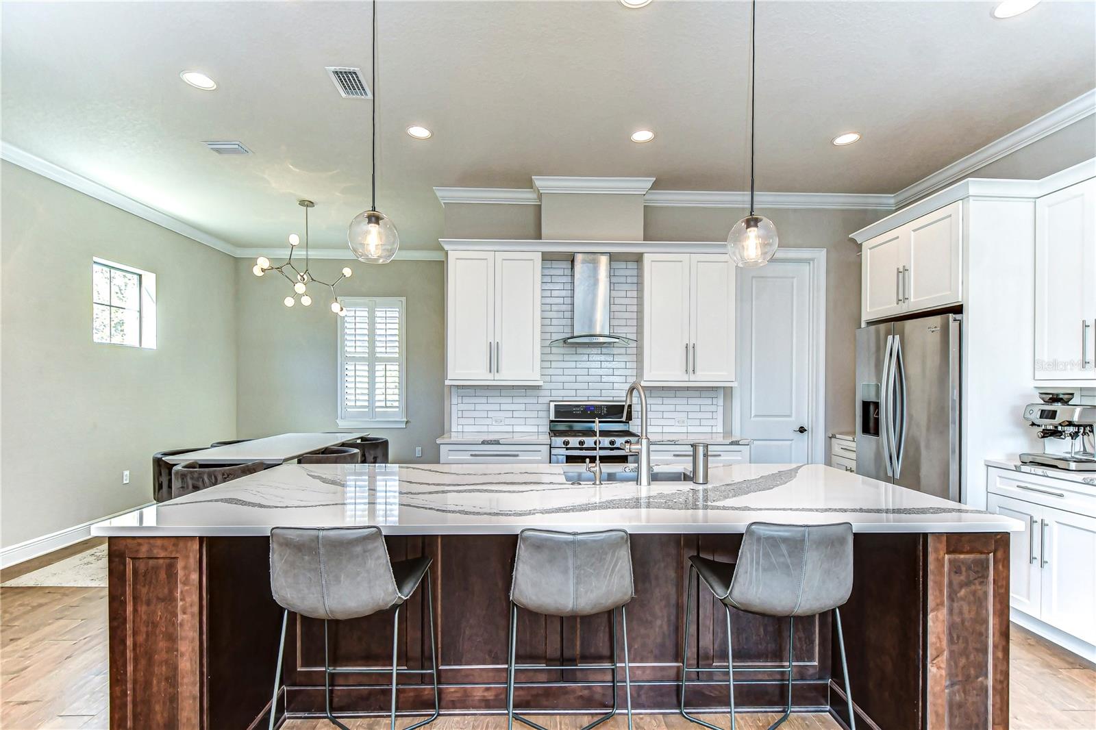 Step into culinary elegance with this gourmet kitchen, where timeless design meets modern flair