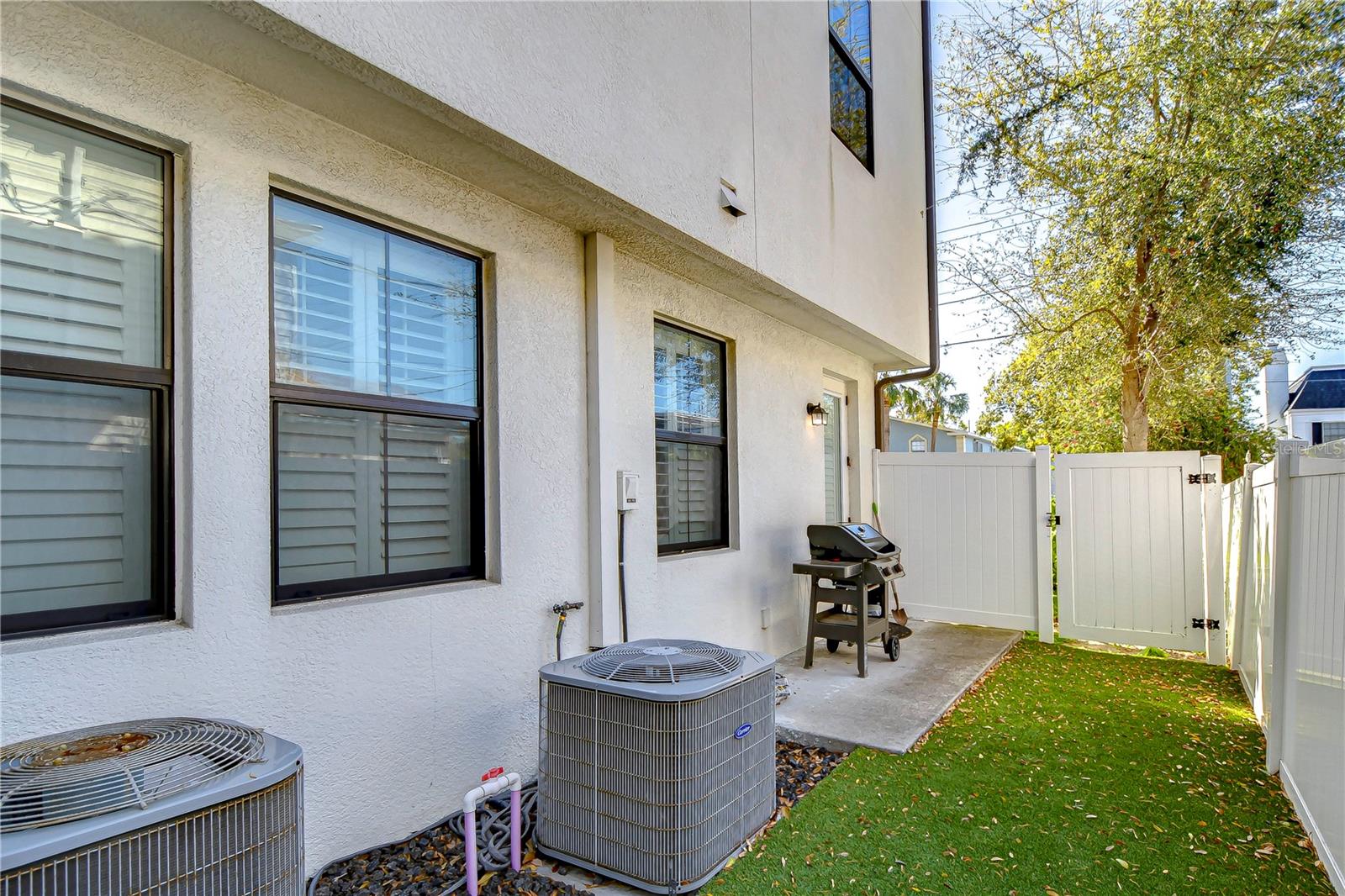 Discover your private oasis, complete with a lush, low-maintenance outdoor space perfect for al fresco dining