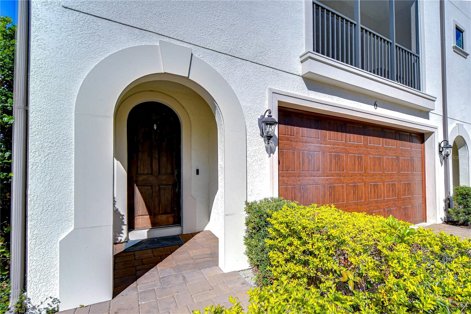 Step through the charming arched doorway of this exquisite townhouse.