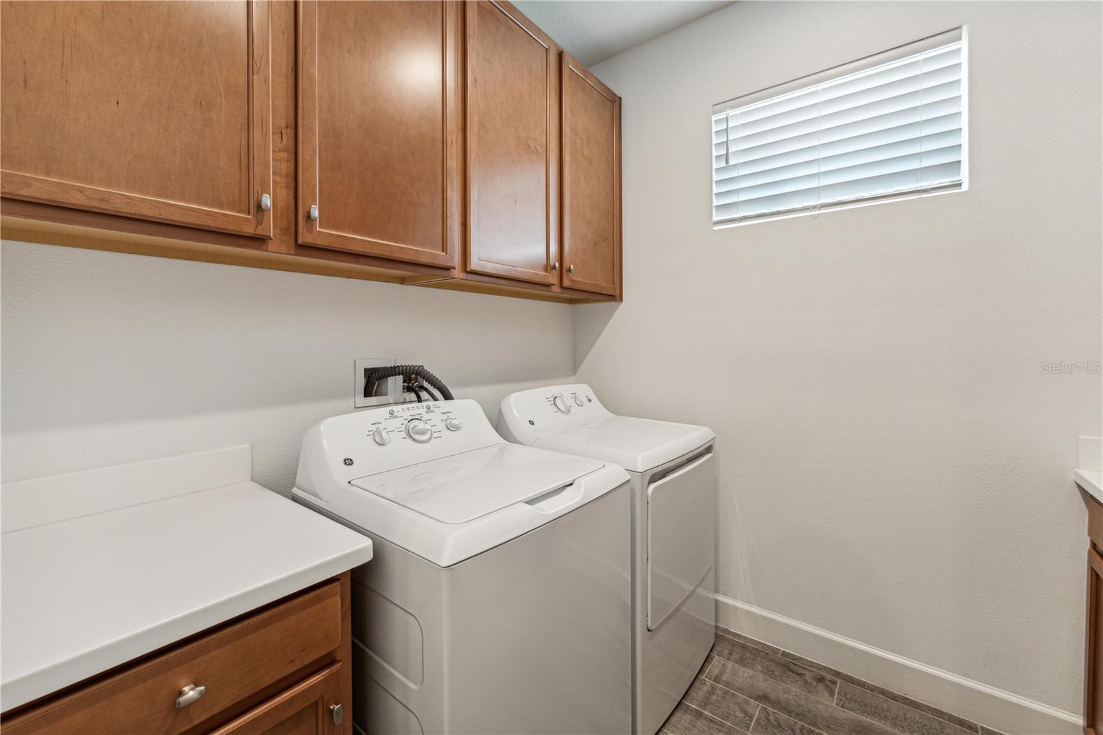 Laundry with full cabinetry