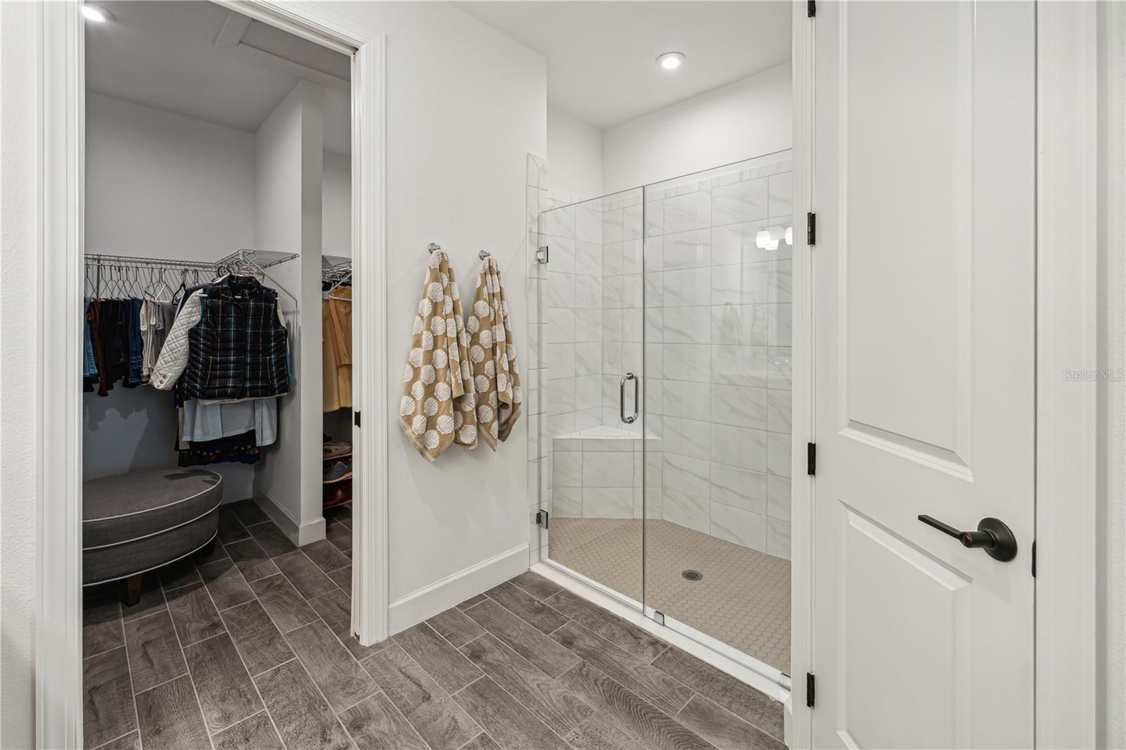 Walk-in primary shower with bench