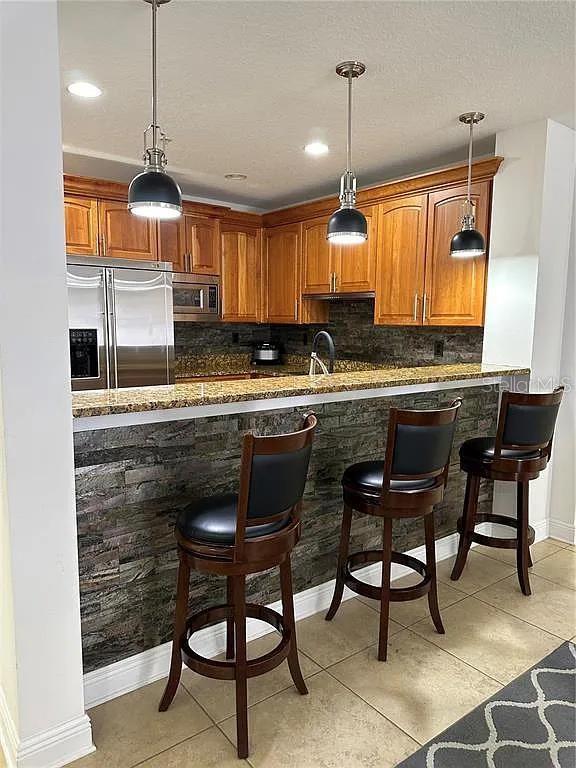 Upscale kitchen with breakfast bar