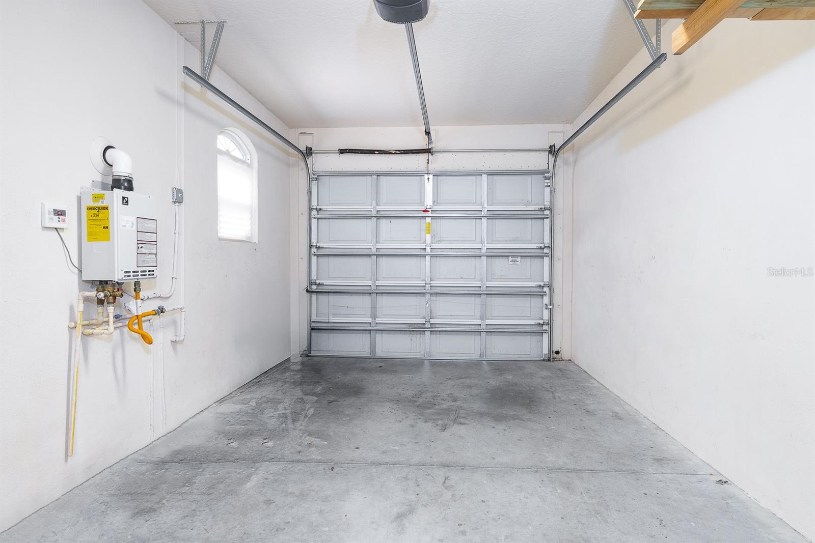 1 car garage/ Garage door opener and tankless water heater included.