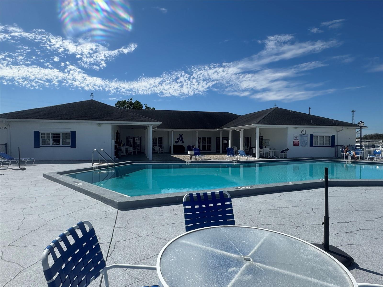 Pool with clubhouse in back