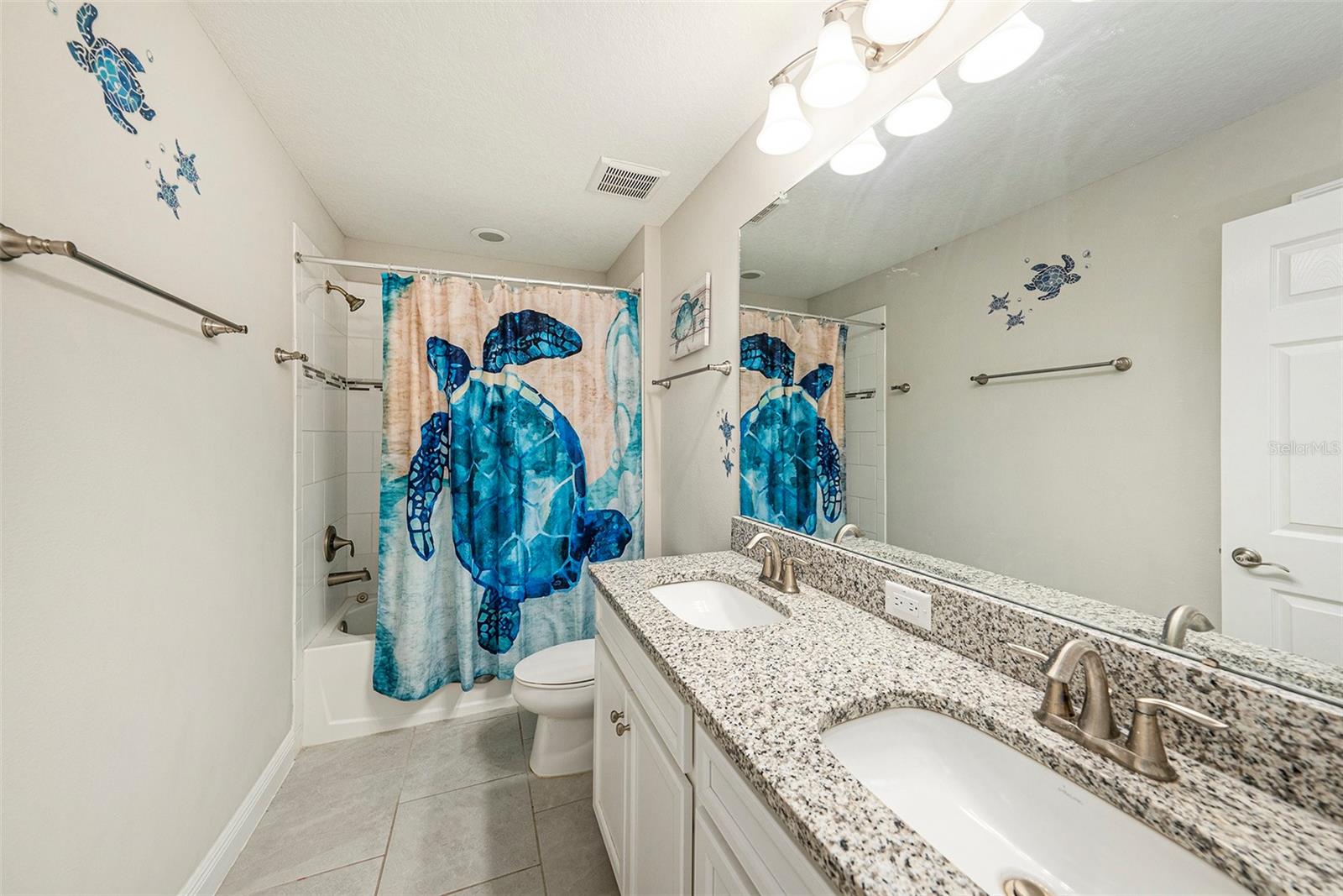 Upstairs guest bath enjoys double sinks for busy mornings!