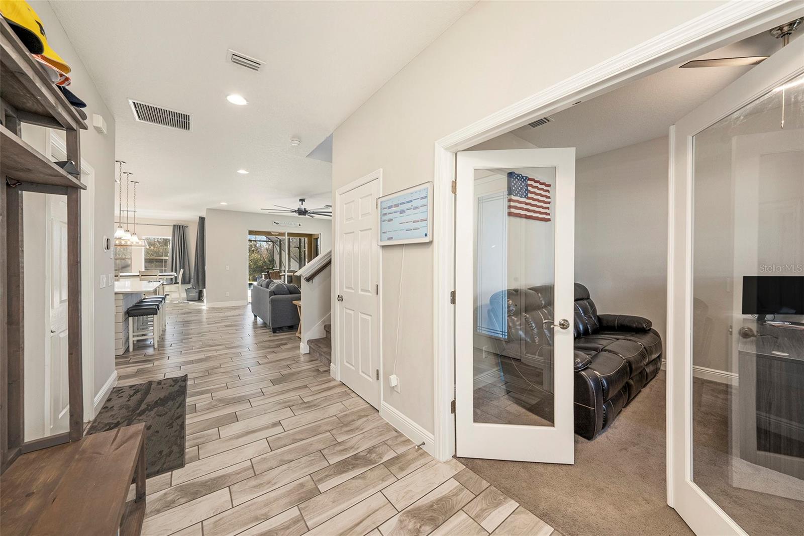 Welcoming foyer with double glass french doors to your home office!