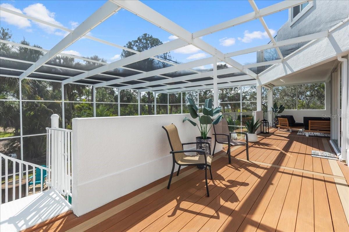 Extension of the 2nd floor patio with spiral stairs down to the pool level. Perfect for entertaining