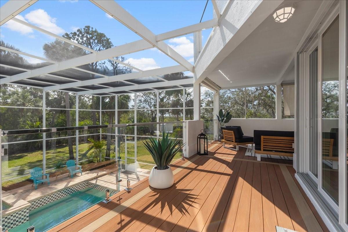 'Invisible' floating glass panel railing with chrome accents