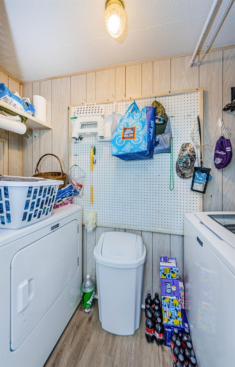 Kitchen with full size washer and dryer