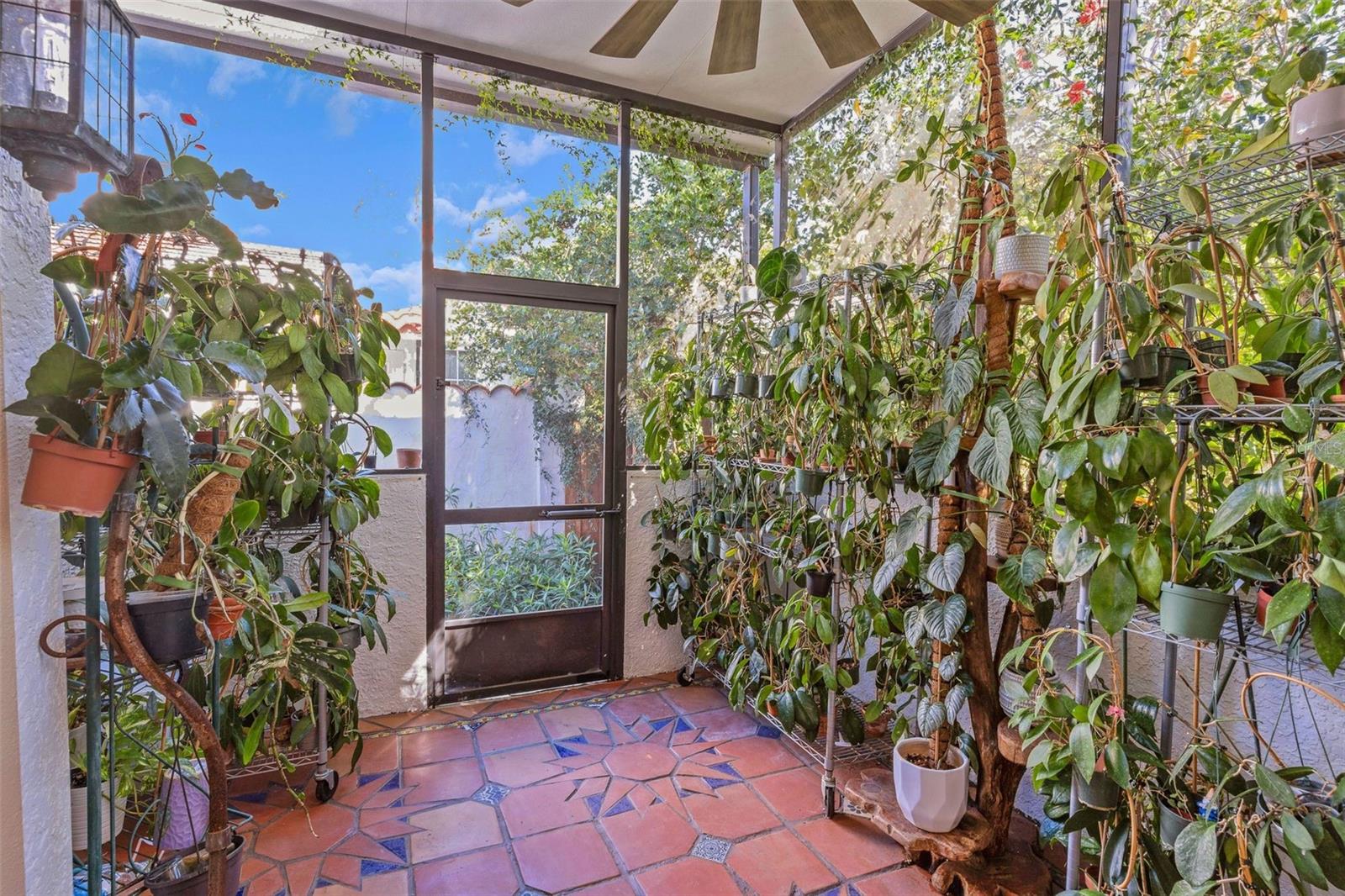 Screened in porch off the kitchen