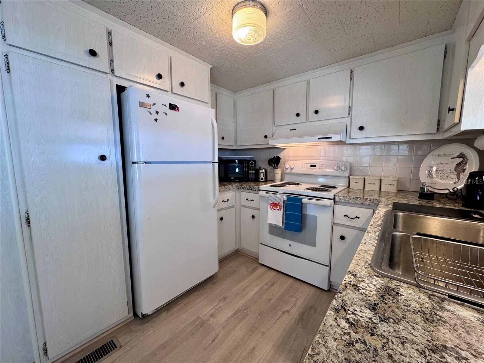 Modern appliances with stainless steel sink.