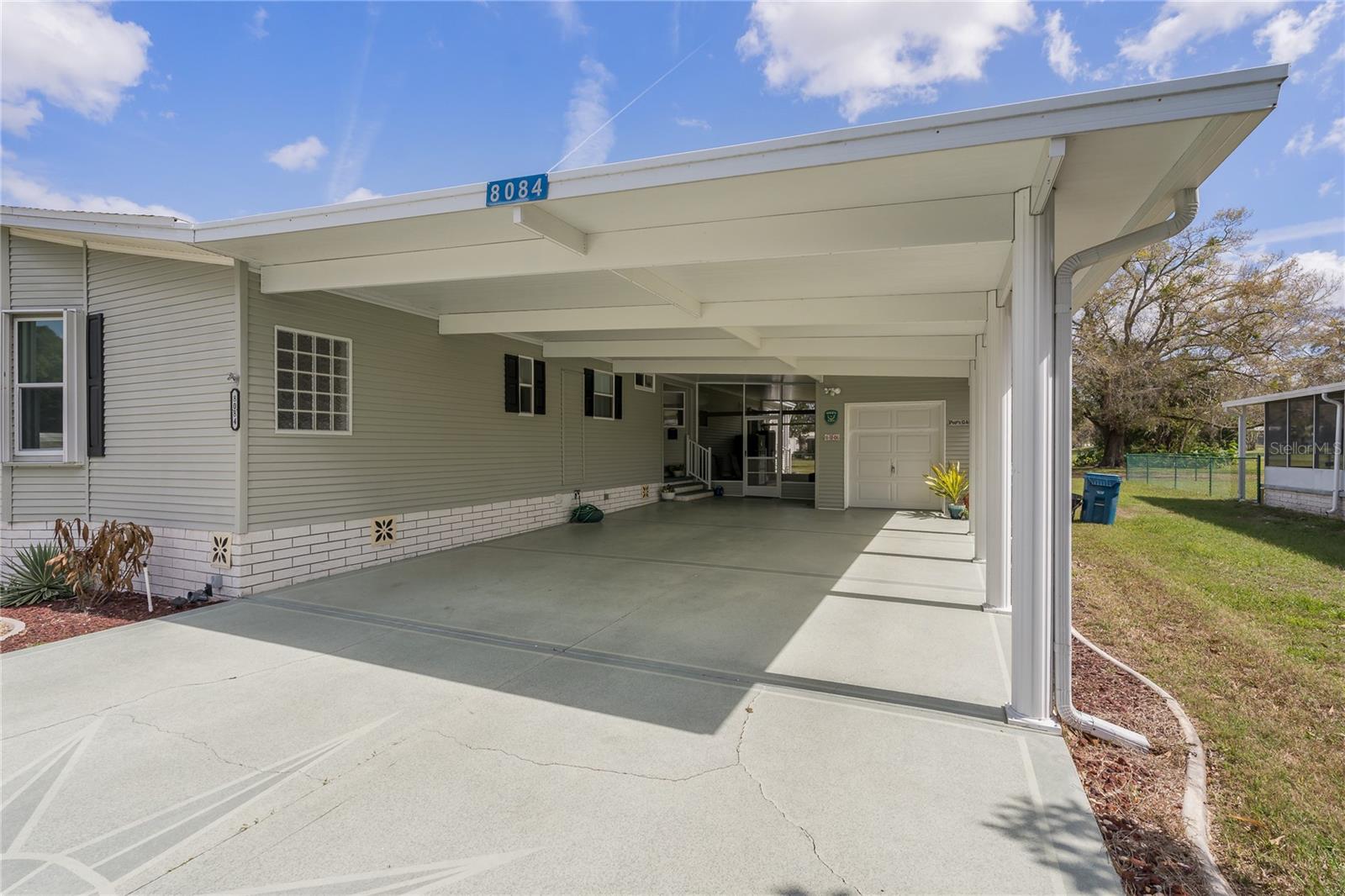 COVERED AND SPACIOUS CARPORT