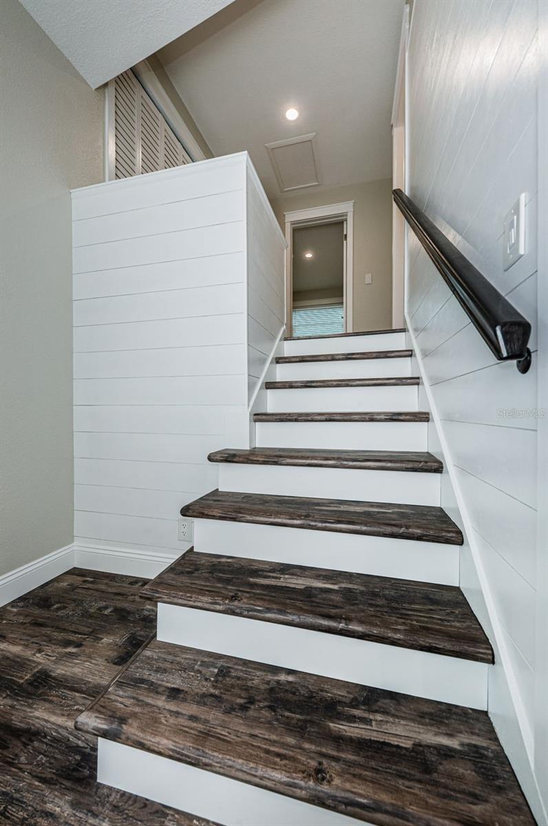 Stairs from foyer to third level