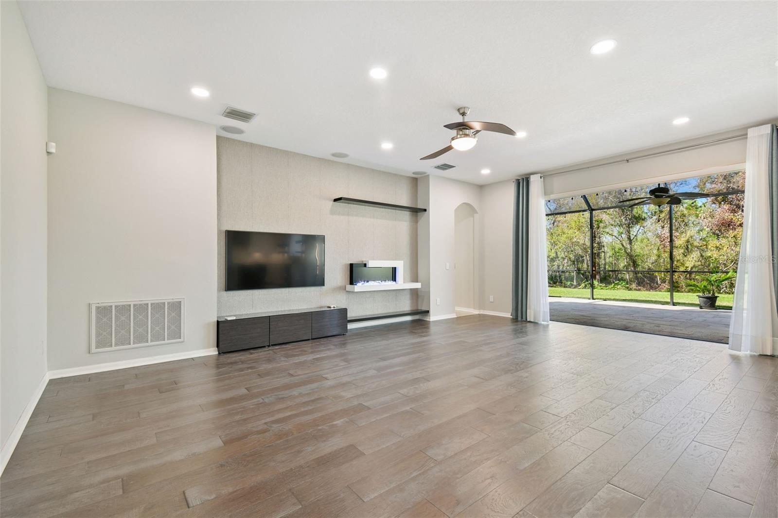 Spacious Family Room with Frame TV and aesthetic fireplace