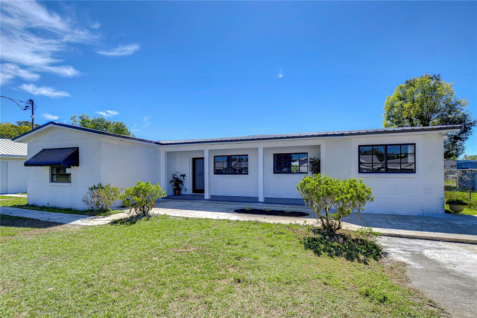 nviting charm with a cozy porch, this delightful home promises relaxed living.