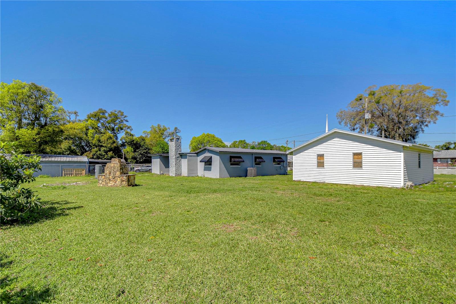 Explore the expansive backyard of this inviting Dover home, perfect for enjoying sunny Florida days or hosting lively gatherings with friends.