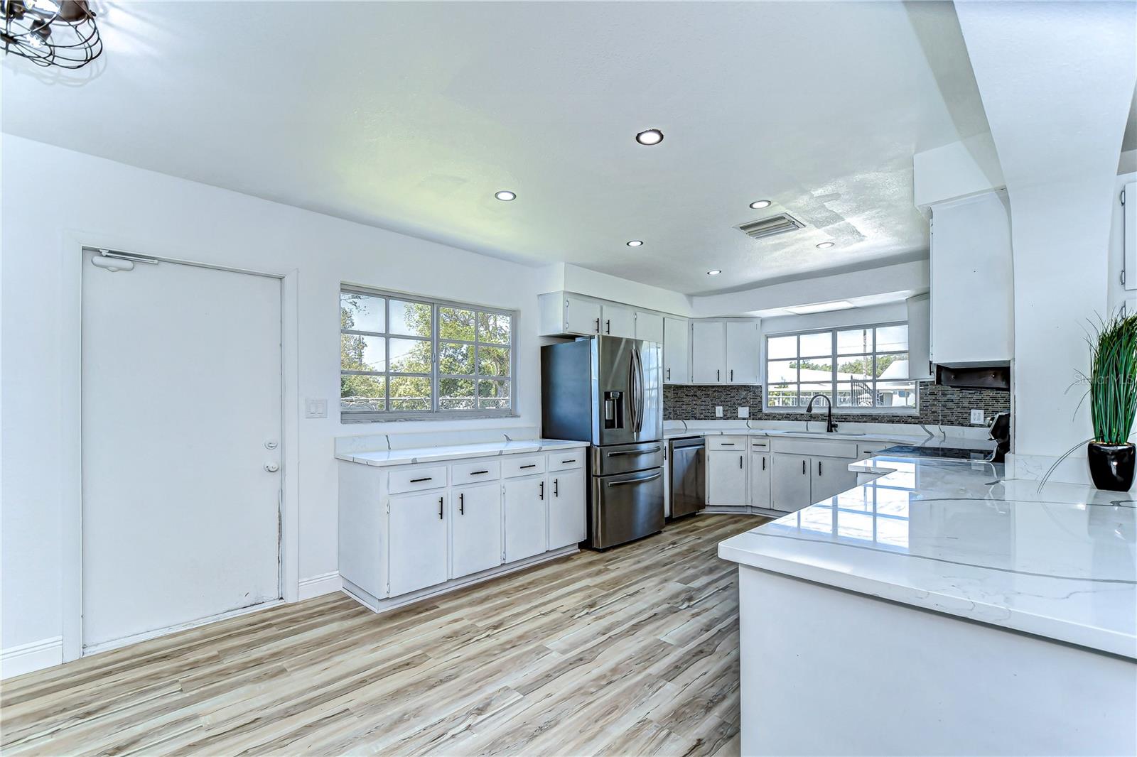 Step into a kitchen where style meets functionality with sleek stainless steel appliances and generous counter space.