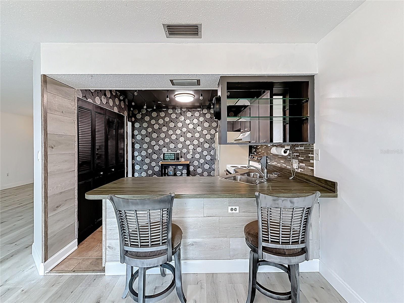 View into kitchen from dining area.