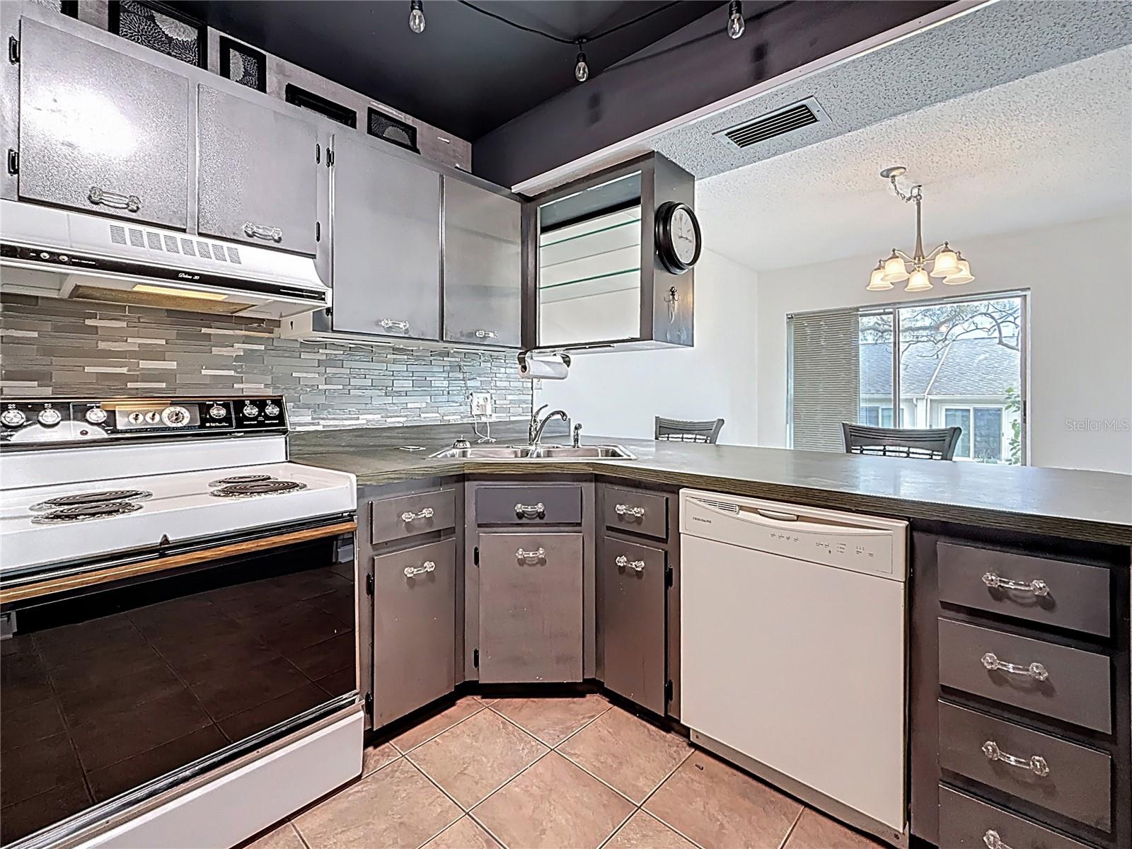 Closer view of kitchen space. The pantry is  to your right.