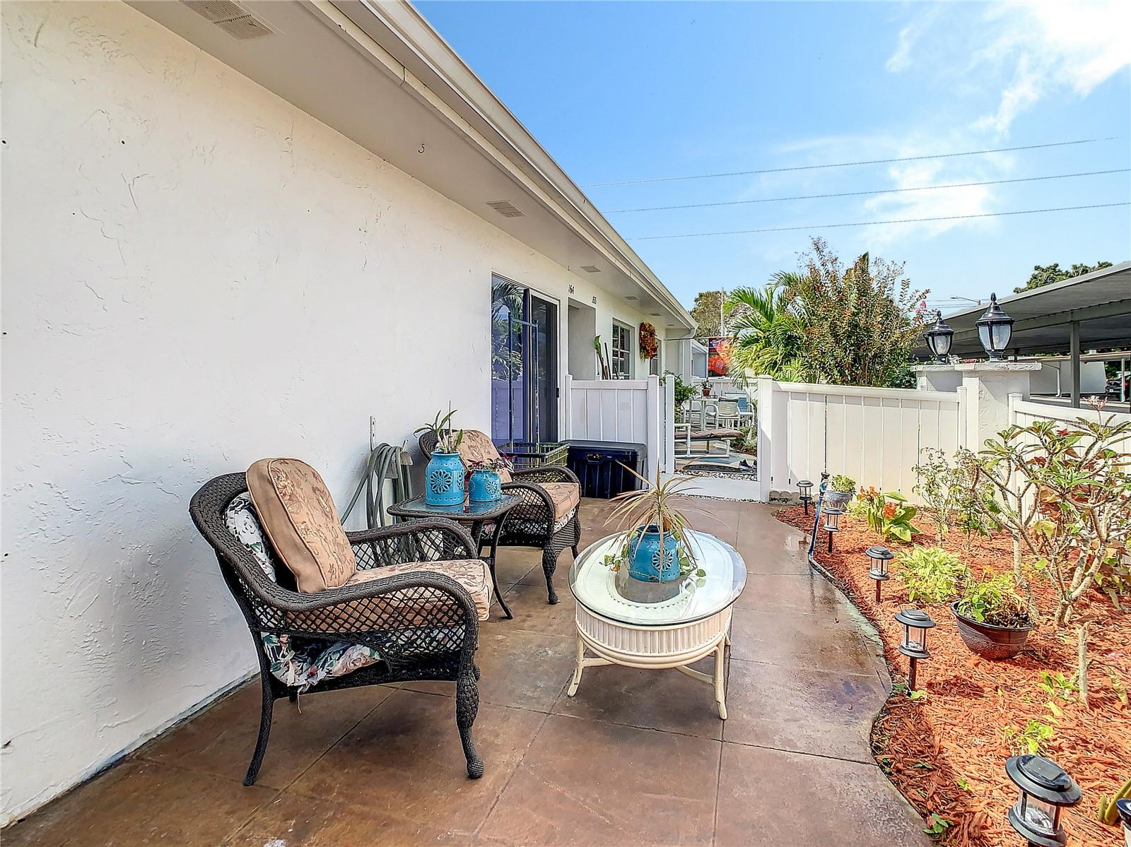 Front porch of villa from primary bedroom door.