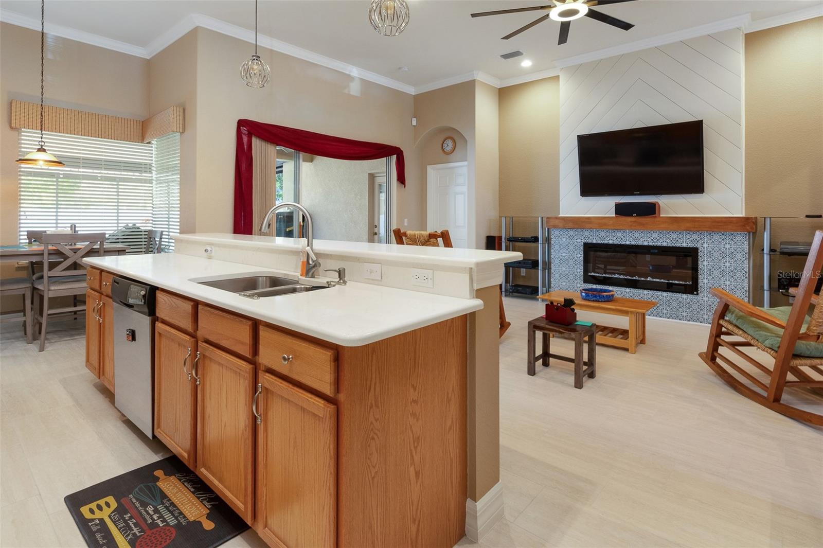 View of fireplace from kitchen