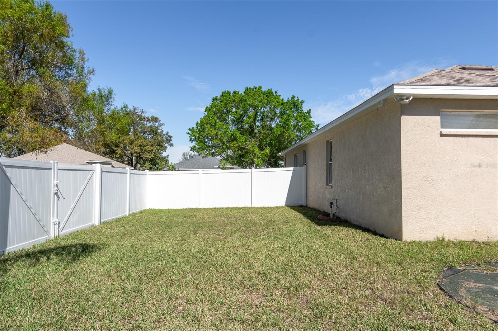 Backyard totally fenced in with entry gate.S