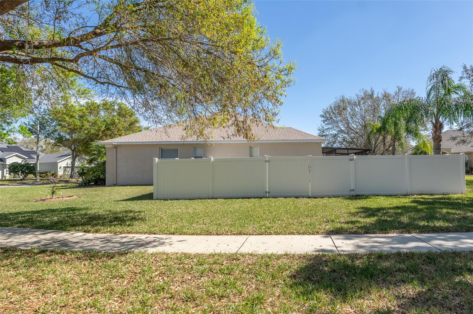 Fenced side of property offers space and privacy.