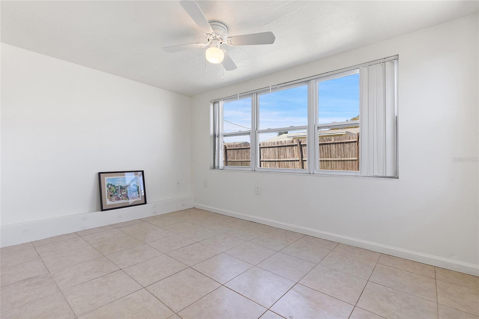 4th Bedroom or office with side door to the back yard.